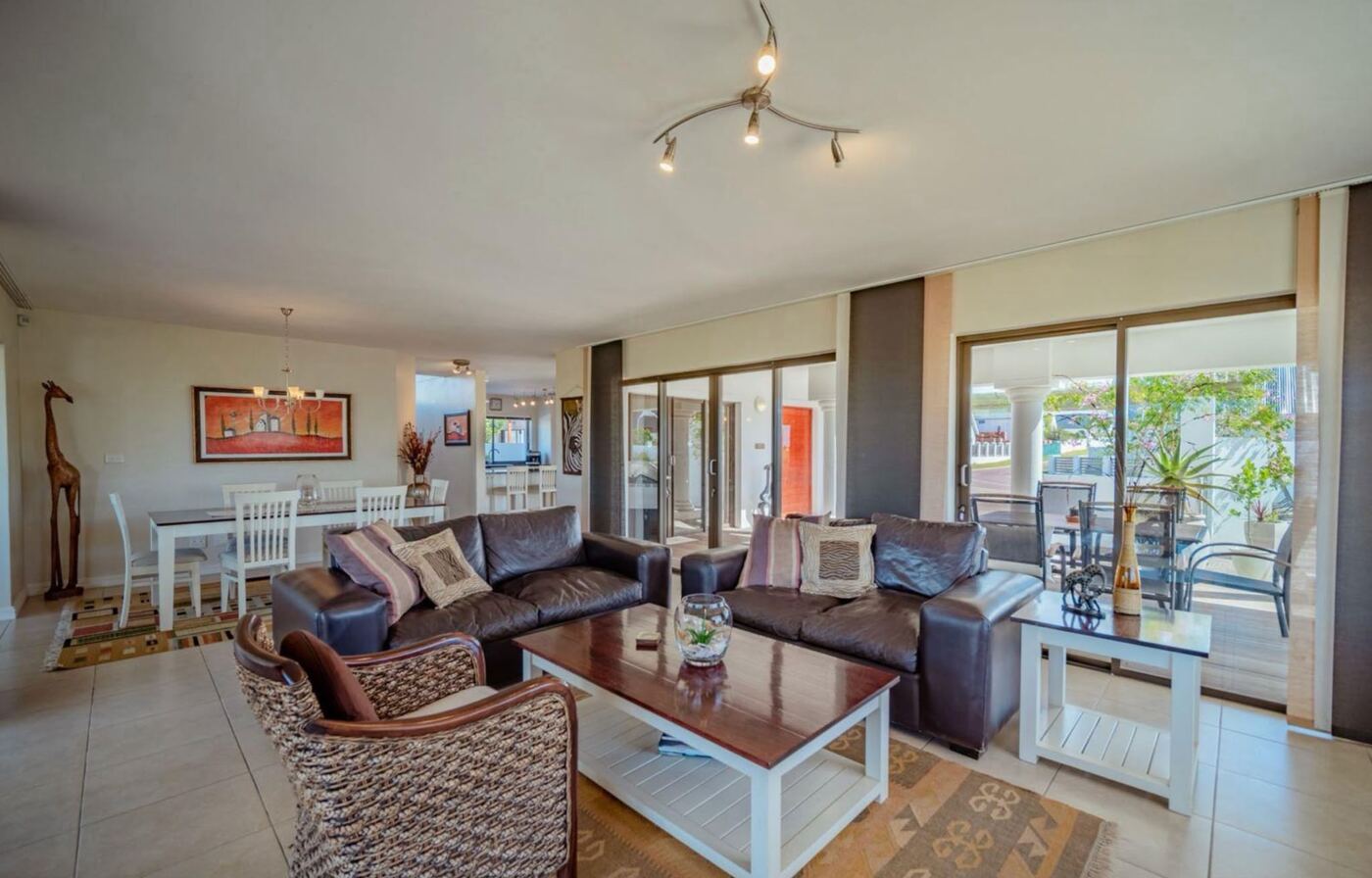 Open-plan lounge and dining room opening onto the veranda